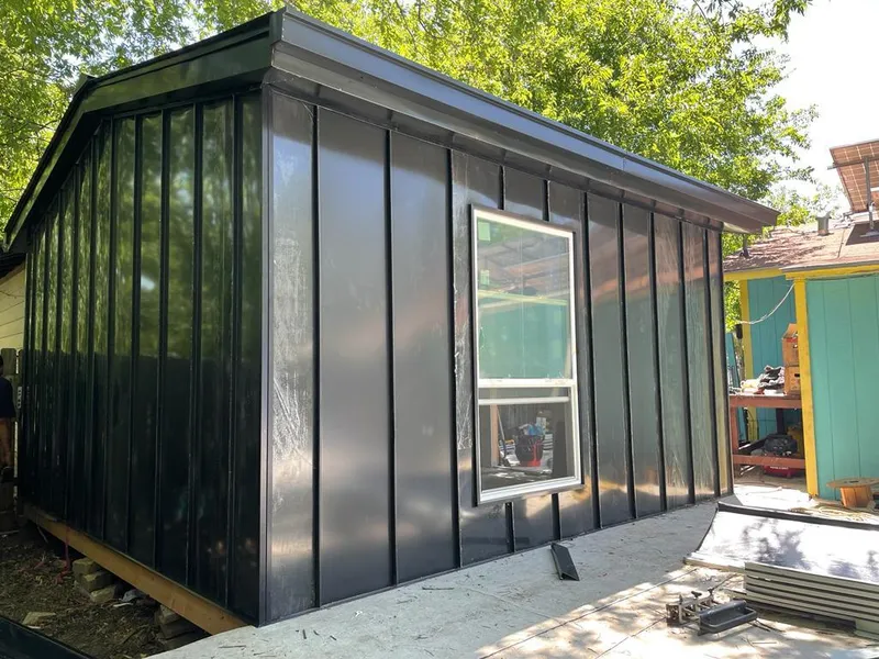 Black standing seam metal wall panels for Roof Inspection in Rantoul